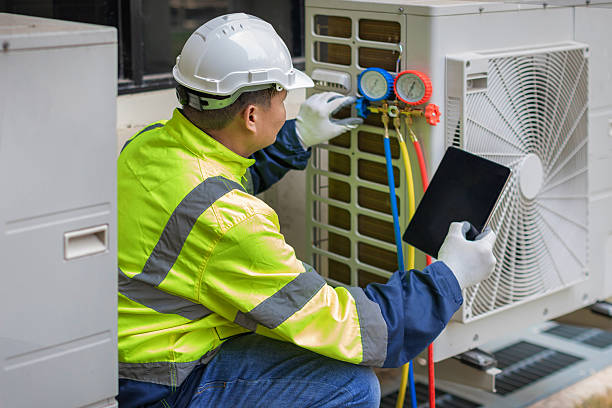 Professional Air Conditioning Repair technician working in Kingsford Heights, IN